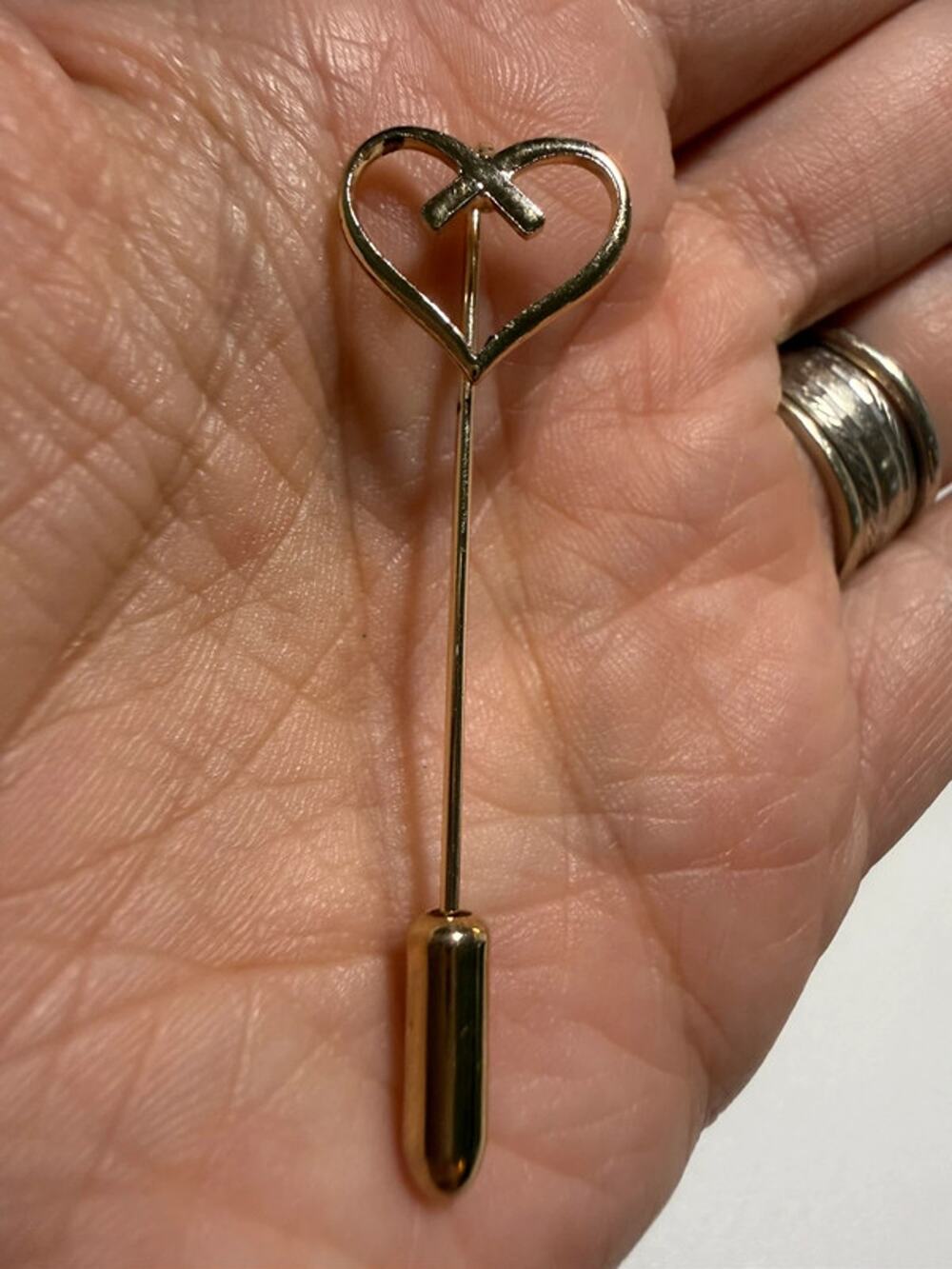 Gold tone heart stick pin